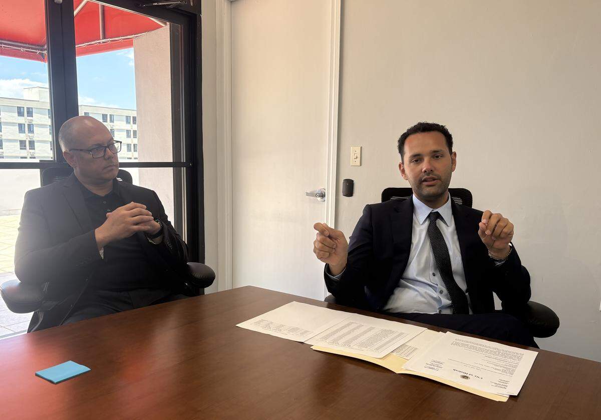 Hialeah Mayor Bryan Calvo, right, says the city is attempting to collect millions of dollars in delinquent water and sewer debt from Palmetto General Hospital and Hialeah Hospital. Calvo’s chief of staff, Jose Torres, is pictured on the left.